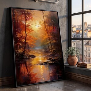 May include: A framed rectangular wall art piece featuring an impressionistic oil painting of a forest stream at sunset. The scene displays vibrant orange, yellow, and deep brown foliage reflecting in the water, with a bright sun glowing through trees.