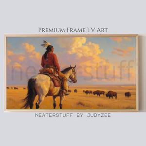 May include: A framed print of a painting depicting a Native American on horseback, overlooking a herd of bison on a prairie. The sky is filled with clouds, and the text "PREMIUM FRAME TV ART" and "NEATERSTUFF BY JUDYZEE" are visible.