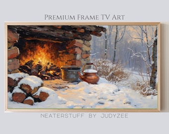 May include: A framed painting depicts a cozy winter scene. A roaring fireplace with burning logs is in a stone structure. A copper kettle and pot sit in the snow. The text "PREMIUM FRAME TV ART" and "NEATERSTUFF BY JUDYZEE" are visible.