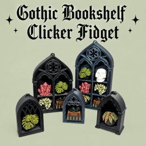 May include: Five black gothic bookshelf clicker fidget toys with pointed arches. The shelves contain miniature items including green monstera plants, a white skull, pink crystals, and a black cat on books. The text reads Gothic Bookshelf Clicker Fidget.