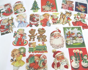 Pode incluir: Um conjunto de recortes de papel de Natal vintage com Papai Noel, renas, bonecos de neve, crianças e um trem. Os recortes são impressos em papel branco com ilustrações coloridas.