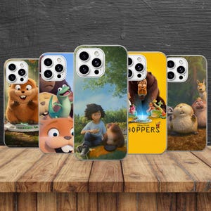 May include: Five smartphone cases featuring colorful animated characters from the movie Hoppers. The designs display various woodland creatures, a person sitting in a forest, and the movie title text Hoppers on a yellow background.