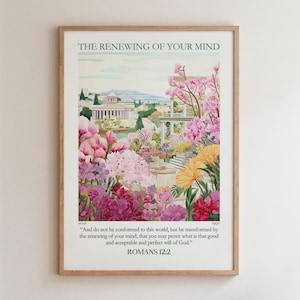Puede incluir: Una lámina de arte mural vertical en un marco de madera clara que muestra un paisaje de jardín con flores rosas y amarillas, un edificio clásico y el texto THE RENEWING OF YOUR MIND y el versículo bíblico Romans 12:2 en letras verde oscuro.