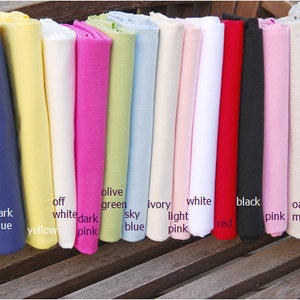May include: A collection of fabric swatches in various colors, including navy, dark blue, yellow, off white, dark pink, olive green, sky blue, ivory, light pink, white, red, black, pink, oat meal, and grey.