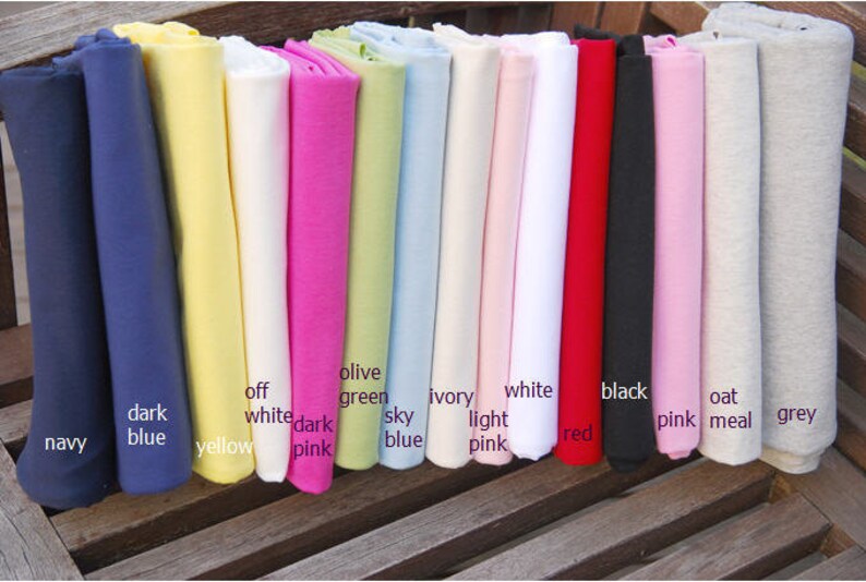 May include: A collection of fabric swatches in various colors, including navy, dark blue, yellow, off white, dark pink, olive green, sky blue, ivory, light pink, white, red, black, pink, oat meal, and grey.
