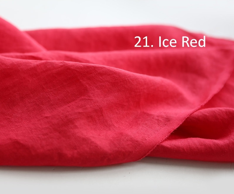 May include: A close-up of a bright red fabric, showing its texture and drape. The fabric is labeled "21. Ice Red."