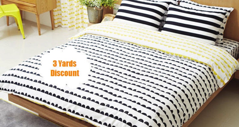 May include: A white and black patterned duvet cover with a yellow and white striped pillow and a black and white striped pillow. The duvet cover has a pattern of black half circles on a white background. The text "3 Yards Discount" is visible in the image.