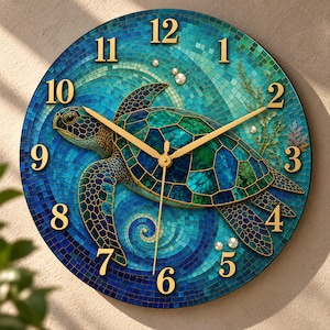 May include: A round wall clock featuring a mosaic-style illustration of a sea turtle swimming in blue and green water. The clock face has gold-colored numerals from 1 to 12 and matching gold-colored hour, minute, and second hands.