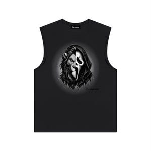 May include: A black sleeveless shirt featuring a graphic print of a split face, with one side depicting a lion and the other a masked figure in a hooded cloak. The text "Be Our Vest" is printed near the neckline and below the graphic design.