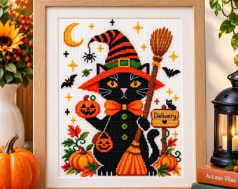 May include: A framed cross-stitch embroidery featuring a black cat wearing an orange and black striped witch hat and a bow tie. The cat holds a broom and a jack-o'-lantern, with a sign labelled Delivery, bats, stars, and a crescent moon.