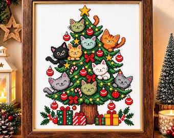 May include: A framed cross-stitch embroidery depicting a green Christmas tree decorated with red ornaments, yellow stars, and candy canes. Multiple colourful cats are nestled within the branches. Wrapped gift boxes sit at the base of the tree.
