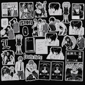 May include: A collection of black and white vinyl stickers featuring characters and scenes from the Death Note anime series, including illustrations of Light Yagami, L, Ryuk, and Misa Amane, along with text elements like Death Note and Japanese kanji.