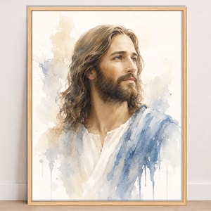 May include: A framed watercolor painting depicting a person with long brown hair and a beard, wearing a white garment draped with a blue cloth. The figure is shown from the chest up, looking toward the right against a soft, light-colored background.
