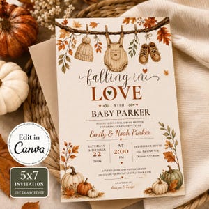 Puede incluir: Una tarjeta de invitación rectangular para baby shower con ilustraciones en acuarela de un gorro de punto, un peto de bebé y zapatos colgados de una rama con hojas de otoño. El texto dice falling in LOVE with BABY PARKER, incluyendo detalles.
