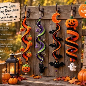 May include: Four crochet Halloween spiral hanging decorations featuring orange and black pumpkins, a purple and green spiral with a black cat, a black and orange spiral with bats and a moon, and a black and orange spiral with a ghost and pumpkin.