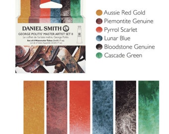 May include: Daniel Smith George Politis Master Artist Set II watercolor paint set with six tubes of paint in the colors Aussie Red Gold, Piemontite Genuine, Pyrrol Scarlet, Lunar Blue, Bloodstone Genuine, and Cascade Green. The set includes a small metal box with a rusty metal design.