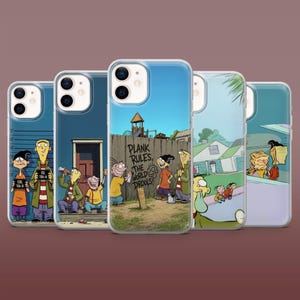 May include: A collection of five clear smartphone cases featuring colourful cartoon illustrations of characters from Ed, Edd n Eddy. The designs include scenes of the characters in various poses, including a mugshot lineup and a wooden fence with the text PLANK RULES THE WORLD DROOLS.