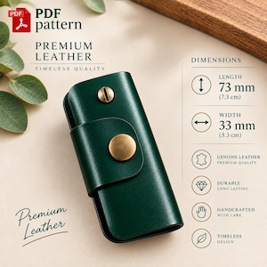 May include: A dark green leather key holder with a brass snap button closure and a brass screw post. The item measures 73 mm in length and 33 mm in width. Text on the image includes PDF pattern, Premium Leather, Timeless Quality, and Dimensions.