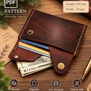 May include: A dark brown leather wallet featuring a flap closure with a brass snap button, visible orange stitching, and three internal compartments holding cards and paper currency. The wallet measures 105 mm in length and 70 mm in width.