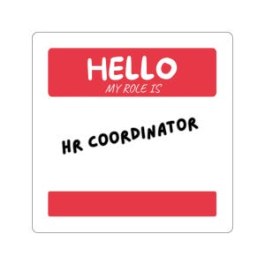 May include: A square name tag sticker with a red top bar featuring the white text HELLO MY ROLE IS. The center white area contains the black text HR COORDINATOR in a bold font. A red bottom bar completes the design of this professional label.