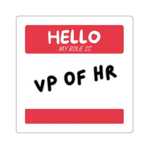 May include: A square white sticker with a red rectangular header containing the white text HELLO MY ROLE IS. Below the header, the black text VP OF HR is printed in a bold, sans-serif font. A red rectangular footer is at the bottom.