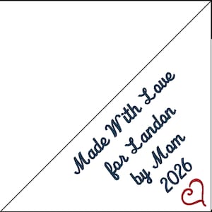 May include: White triangular design with the text "Made With Love for Landon by Mom 2026" in dark blue script. A red heart is in the lower right corner. The design is on a white background.