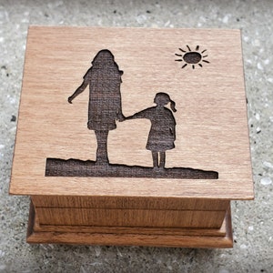 Mom Music box made with high quality USA wood. This music box has mom and daughter engraved on the top and you can choose your color and song. Perfect gift for Mom or your daughter