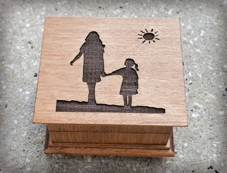 Mom Music box made with high quality USA wood. This music box has mom and daughter engraved on the top and you can choose your color and song. Perfect gift for Mom or your daughter