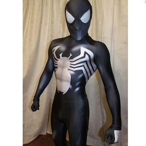 May include: A full-body black spandex bodysuit featuring a large white spider emblem on the chest and back. The suit includes a matching full-head mask with large, white, textured mesh eye lenses, covering the entire head, torso, arms, and legs.