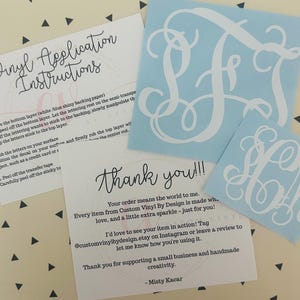 May include: A collection of custom vinyl decals in light blue with white monogram designs. Includes application instructions and a thank you card. The decals are for personalizing items.