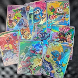 May include: A collection of nine colorful Pokémon trading cards featuring characters including Turtwig, Piplup, Rowlet, Chimchar, Popplio, Litten, Charmander, Bulbasaur, and Squirtle. Each card displays a unique holographic illustration with text.
