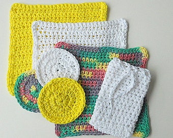May include: A set of five crocheted dishcloths in various colors, including yellow, white, green, and pink. The cloths are made with a textured stitch and are perfect for cleaning dishes or wiping down surfaces.