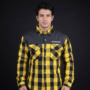 May include: A long-sleeve button-down shirt featuring a yellow and black checkered pattern on the lower body and sleeves, with a solid dark gray panel across the chest and shoulders. The word EXPANDER is printed in white on the left chest.