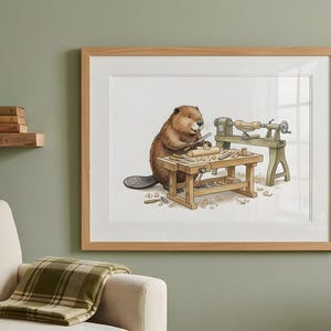 May include: A framed wall art print featuring a brown beaver standing at a wooden workbench, using a chisel to carve a piece of wood. Beside the workbench is a mechanical wood lathe. Wood shavings are scattered on the floor around the workbench.