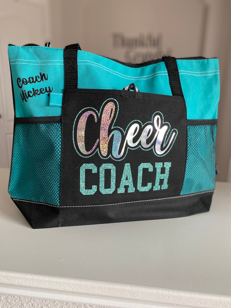 Teal bag with hologram Cheer and teal writing