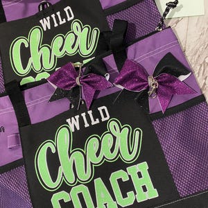 Beautiful purple bag with lime green and white writing. very functional yet blingy.
