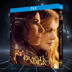 May include: A Blu-ray disc case for the Practical Magic 1-2 collection. The cover features portraits of Sandra Bullock and Dianne Wiest, the title Practical Magic 1-2 in gold lettering, and a small image of two people in black dresses.