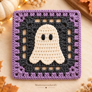 May include: A square crochet granny square featuring a central cream-colored ghost with two black eyes, surrounded by a dark gray border and an outer purple border. The text Moderncrochet4U is printed at the bottom of the square piece.