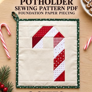 May include: A square fabric potholder featuring a pieced candy cane design in red and white patterns on a cream background, bordered by dark green fabric with small white flowers, and a hanging loop. Text reads CANDY CANE POTHOLDER SEWING PATTERN PDF FOUNDATION PAPER PIECING 2 SIZES.
