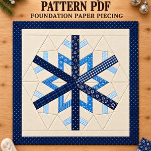 May include: A square quilt block featuring a central blue and white snowflake design made of various patterned fabrics on a cream background, framed by a dark blue border with white dots. Text reads SNOWFLAKE QUILT PATTERN PDF 10 12 14 inches.