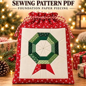 May include: A red and white drawstring gift bag featuring a quilted wreath design in shades of green and white. The text reads WREATH GIFT BAG SEWING PATTERN PDF FOUNDATION PAPER PIECING and 3 SIZES. The bag has a red floral fabric border.