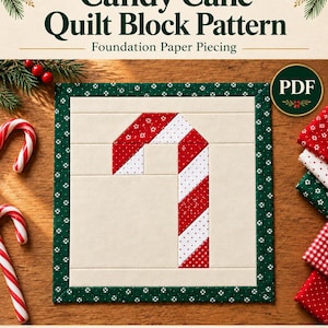 May include: A Scrappy Christmas Candy Cane Quilt Block Pattern PDF for foundation paper piecing in 10, 12 and 14 inch sizes. The quilt block features a central candy cane design with red and white patterned fabric strips.