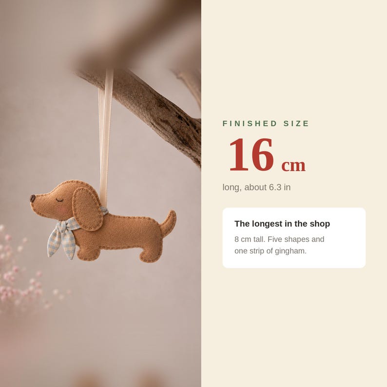 May include: A brown felt dachshund ornament with a light blue and white gingham scarf, hanging from a ribbon. Text indicates a finished size of 16 cm long, 6.3 inches, and 8 cm tall, noting it is the longest in the shop with five shapes.