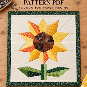 May include: A sunflower quilt pattern PDF for foundation paper piecing, featuring a central sunflower with yellow, orange, and brown fabric segments on a cream background, framed by a dark green floral border, measuring 10, 12, and 14 inches.