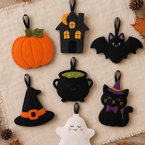 May include: A set of seven felt Halloween ornaments featuring an orange pumpkin, a black haunted house, a black bat, a black witch hat, a black cauldron with green liquid, a white ghost, and a black cat wearing a purple hat and bow tie.