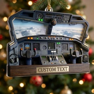 May include: A decorative ornament shaped like an airplane cockpit control panel, featuring a view of clouds through the windshield, two control yokes, various gauges, a headset, a glove, and a wooden base with a plaque reading CUSTOM TEXT.