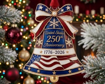 May include: A bell-shaped ornament featuring a red, white, and blue patriotic design with a bow at the top. The text reads United States 250th Anniversary 1776-2026. It includes gold-tone accents, snowflake motifs, and a stylized American flag.