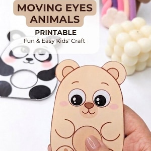 May include: A printable DIY craft featuring a tan bear and a black and white panda with circular cutouts for moving eyes. The text reads DIY MOVING EYES ANIMALS PRINTABLE Fun & Easy Kids' Craft. The bear has a paw print and a round belly.