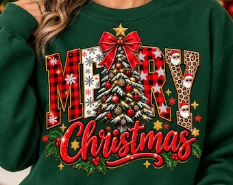 May include: A dark green sweatshirt featuring a graphic with the text Merry Christmas. The design includes a central Christmas tree topped with a red bow, surrounded by red and black buffalo plaid letters, leopard print accents, and Santa faces.
