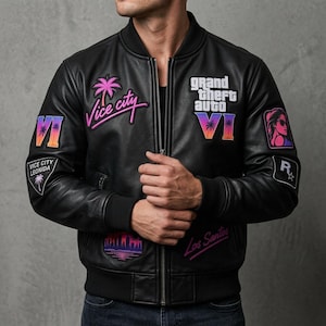 May include: A black leather bomber jacket featuring various patches including the text Vice City, Grand Theft Auto VI, and Los Santos. The jacket has a front zipper closure, ribbed cuffs, and a ribbed collar, with colorful graphic accents.